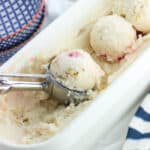 Pineapple upside down cake frozen yogurt is a creamy homemade frozen yogurt recipe that isn't too 'frosty' thanks to a few tips. Vanilla wafers, pineapple chunks, and maraschino cherries are swirled throughout for a fun take on a dessert classic.