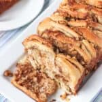 This Maple Walnut Pull-Apart Bread is the perfect bread for brunch (or anytime)! Maple syrup and toasted walnut pieces are bursting throughout this bread with a touch of cinnamon. Plus it's dairy-free!