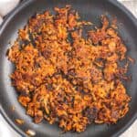 Spiced Sweet Potato Hash Browns - a spin on a breakfast favorite! These hash browns feature a warm spice blend and can be made two ways - either traditionally on the stovetop or baked for a lighter option!