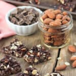 This crunchy dark chocolate almond bark is an easy three-ingredient and no-bake dessert recipe. Like a homemade dark chocolate Crunch bar loaded up with almonds!
