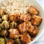 Sheet pan tofu with peanut sauce and brussels sprouts is a satisfying and healthy one-pan meal packed full of flavor. Perfect for Meatless Mondays (or anyday)!