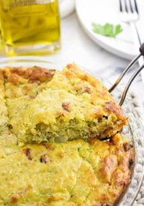 Crustless zucchini quiche is a quicker and easier quiche recipe for a satisfying breakfast or anytime meal. This one-bowl quiche uses Bisquick for structure and features tons of flavor from smoked mozzarella and sun-dried tomatoes.