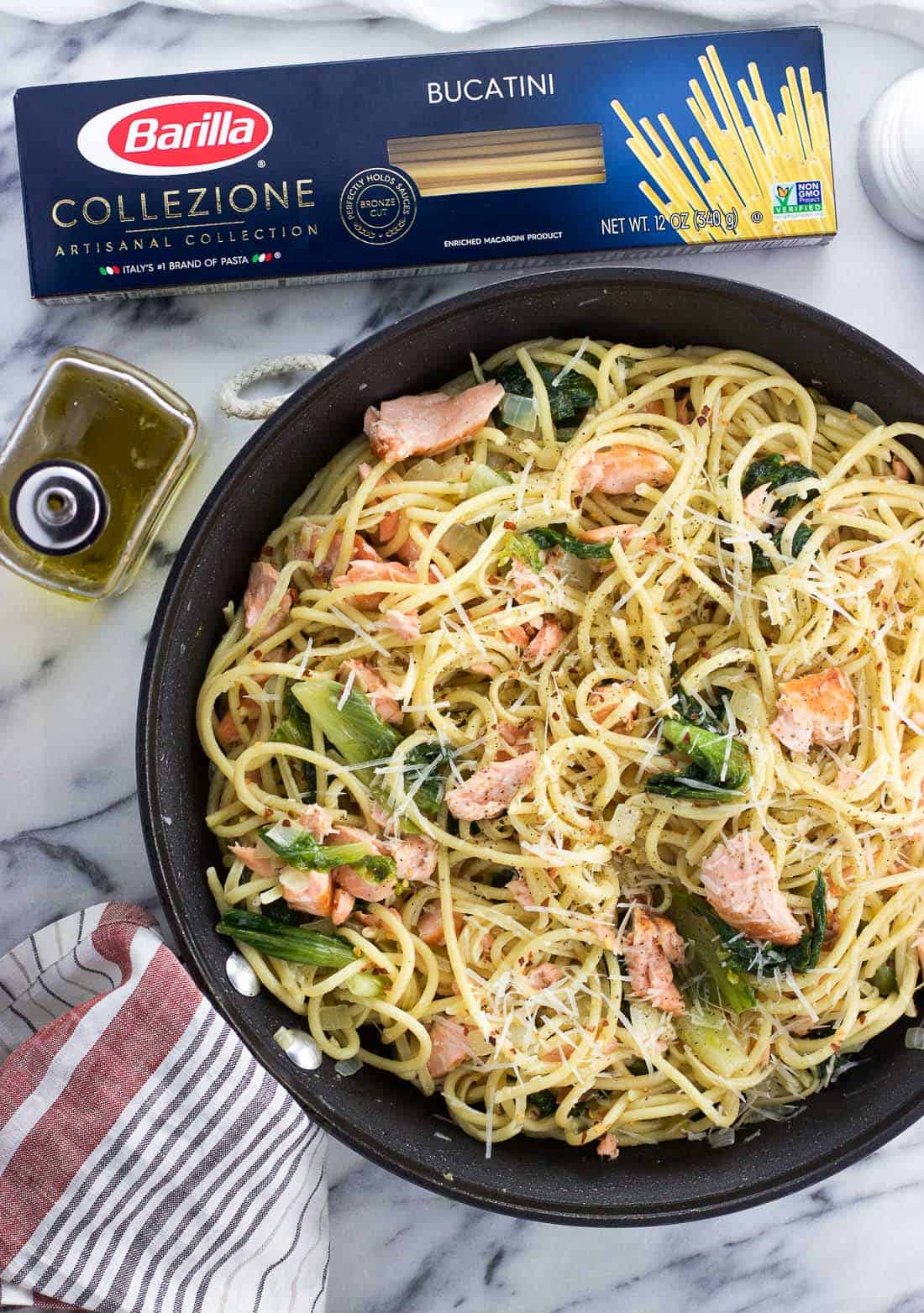 Garlicky salmon pasta with escarole features bright Mediterranean flavors with simple preparation for a meal fit for weeknights or weekends alike.