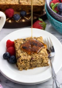 Healthy baked oatmeal bars are naturally-sweetened and maple flavored for a delicious and filling breakfast recipe. Easy to customize with fresh or dried fruit and nuts, these bars are great for snacks, too!