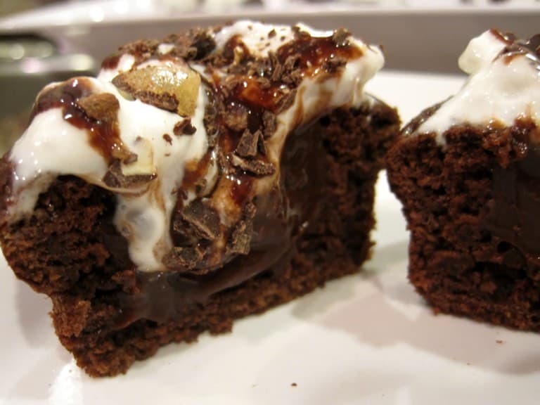 Death by Chocolate Cupcakes cut in half on a plate.