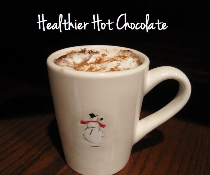 A mug of hot chocolate on a table.