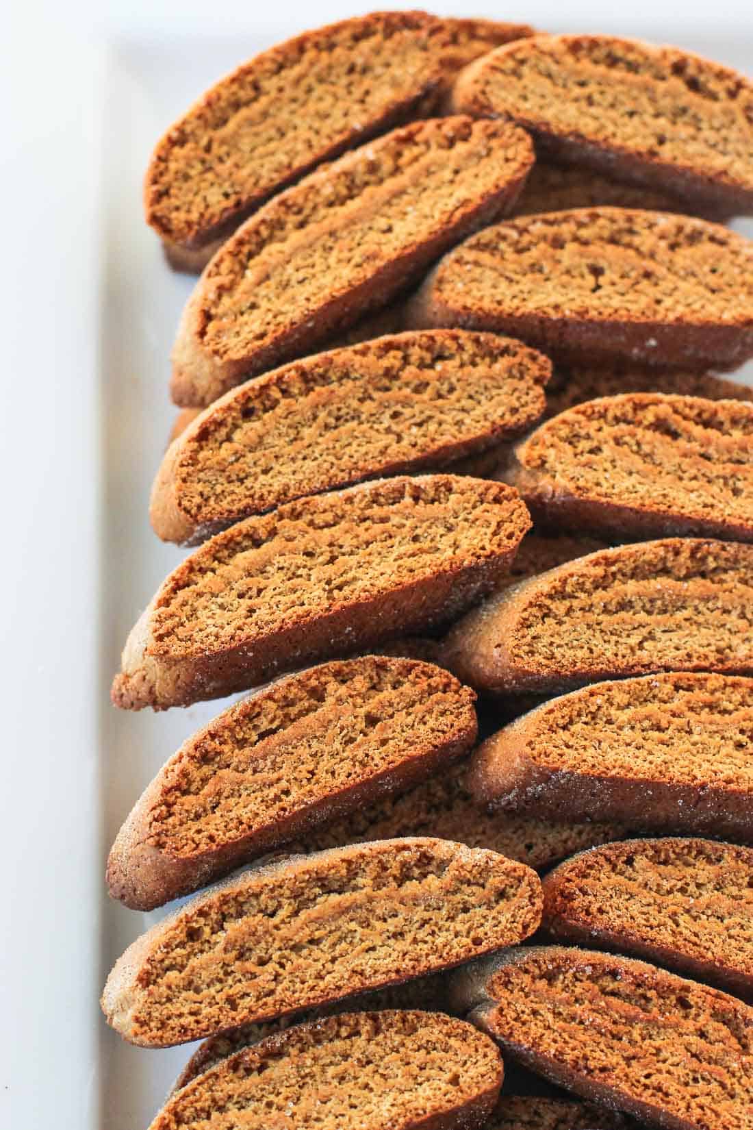 A tray of stacked gingerbread biscotti.