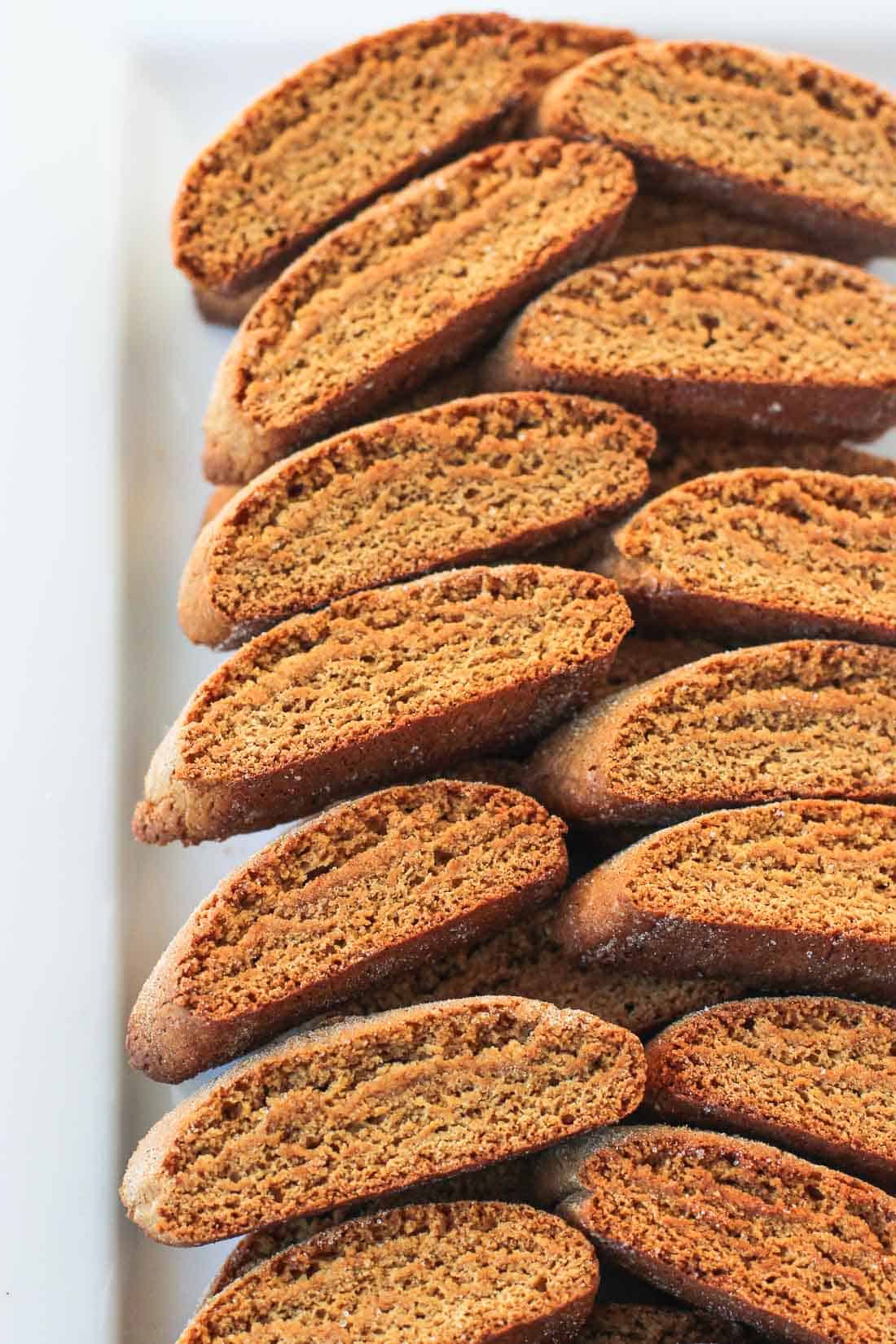 A tray of stacked gingerbread biscotti.