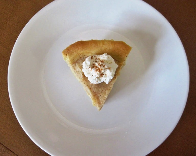 An overhead view of a small piece of gelato pie on a plate.