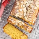 An overhead picture of sliced loaf cake on a wire rack