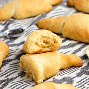 A crescent roll cut in half showing a swirled filling