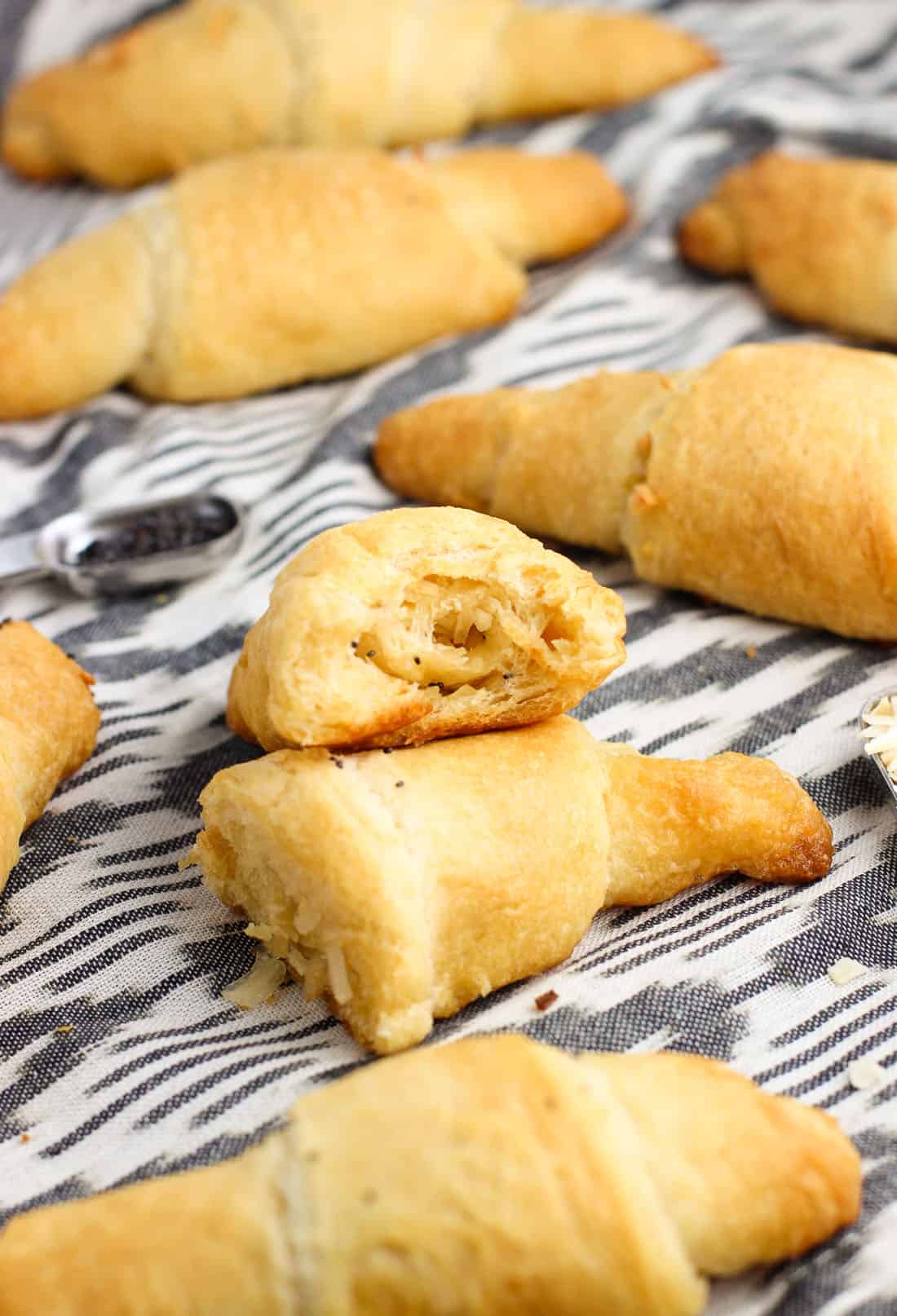 A crescent roll cut in half showing the swirled onion filling