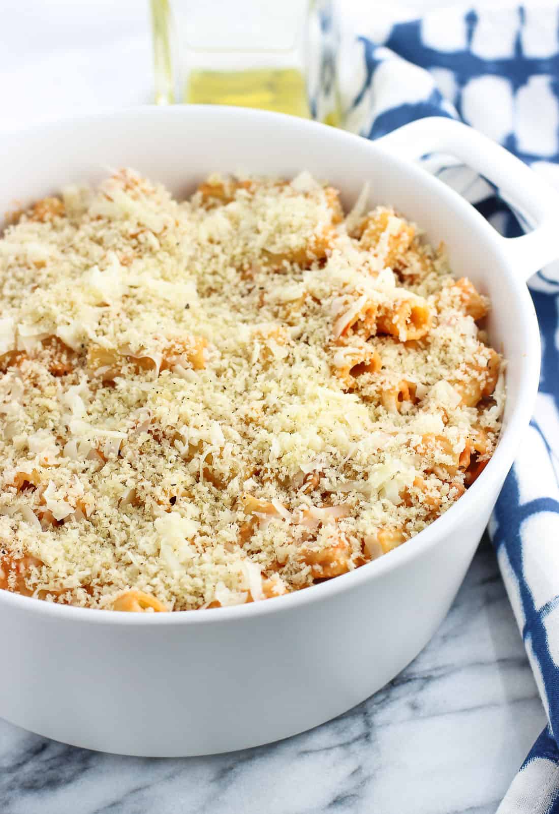 Panko sprinkled on top of a pasta bake before going in the oven.