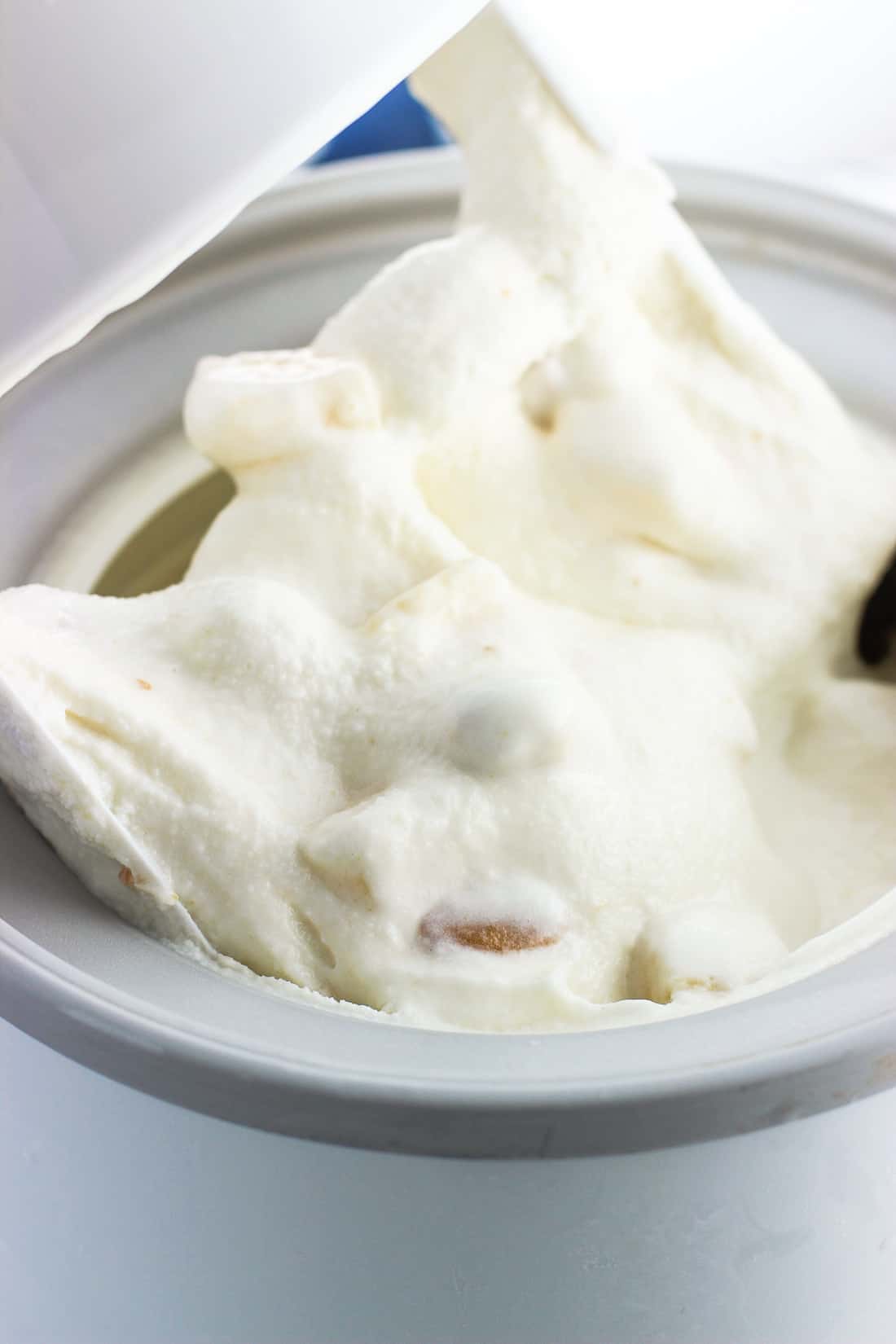 Soft frozen yogurt in the ice cream maker right after being churned.