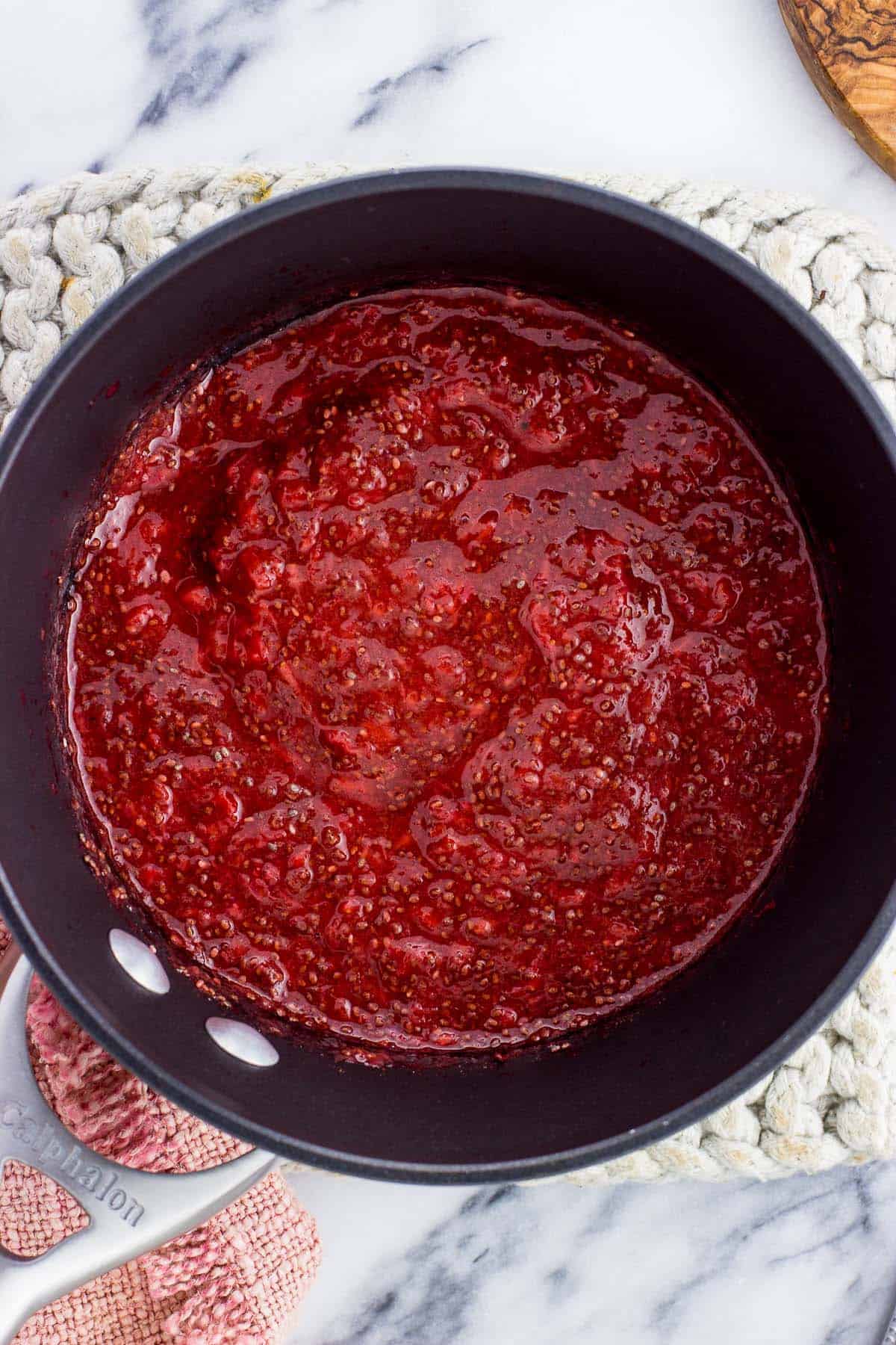 Thickened strawberry chia jam in the saucepan.