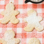 A close-up of confectioners' sugar-dusted cookies.