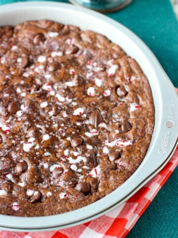 Peppermint mocha cookie cake in a round metal cake pan.