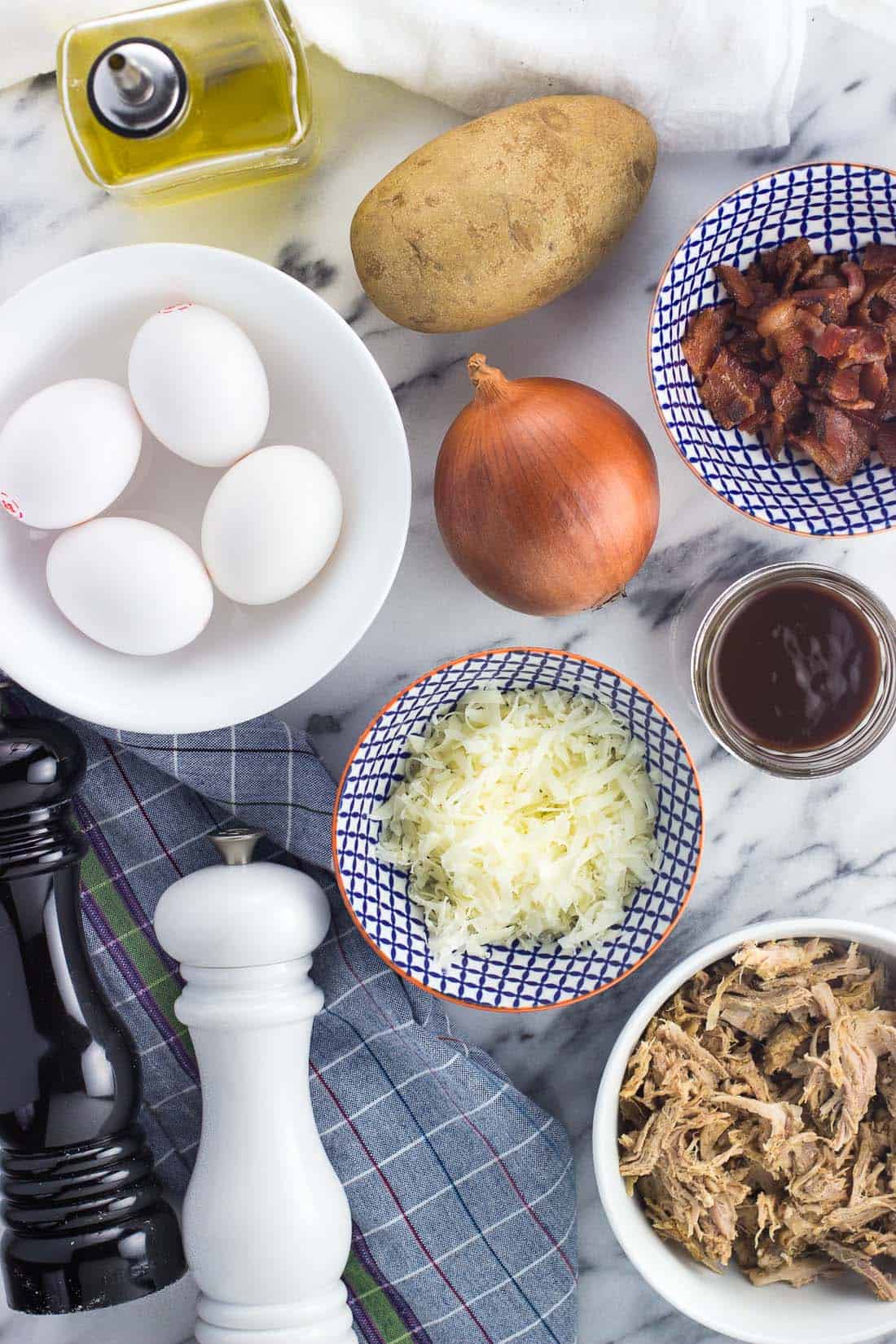 An overhead photo of the ingredients in separate bowls on a marble board