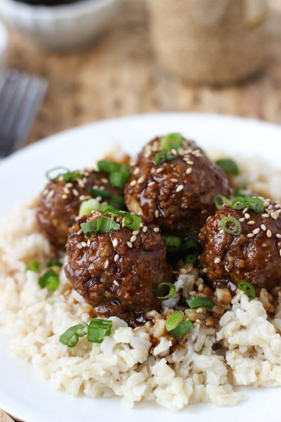 A close-up picture of meatballs served over rice