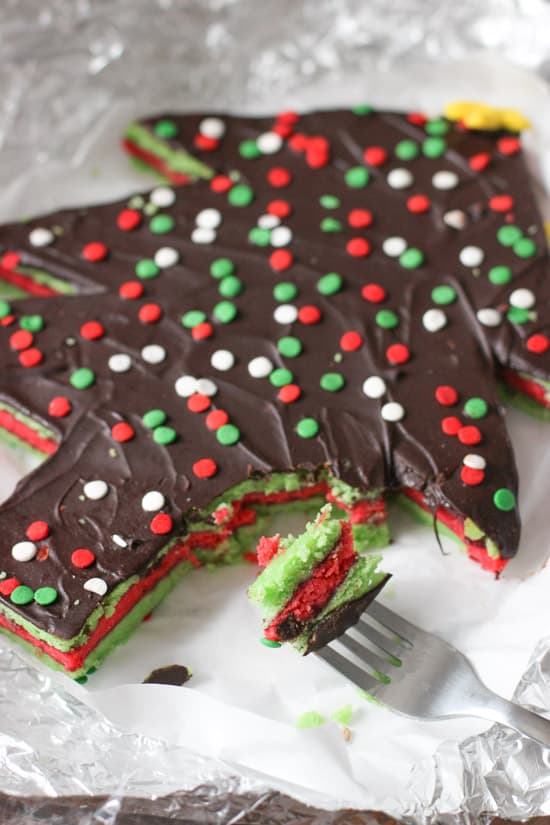 A forkful of Christmas rainbow cookie cake.
