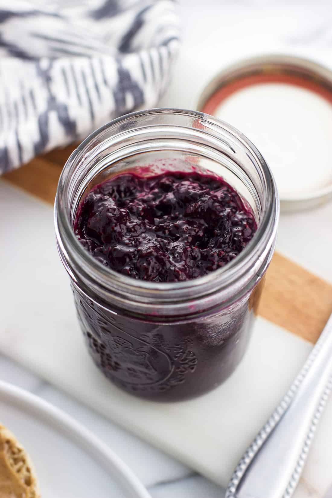 A glass jar filled with blueberry chia jam
