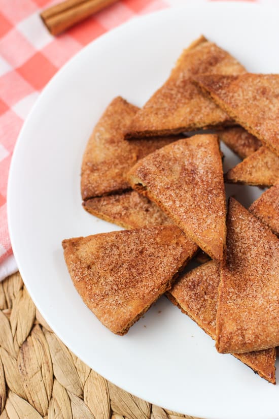 A pile of cinnamon sugar pita chips on a plate.
