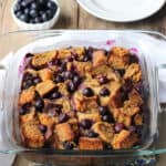 The blueberry french toast bake in a square glass baking dish.