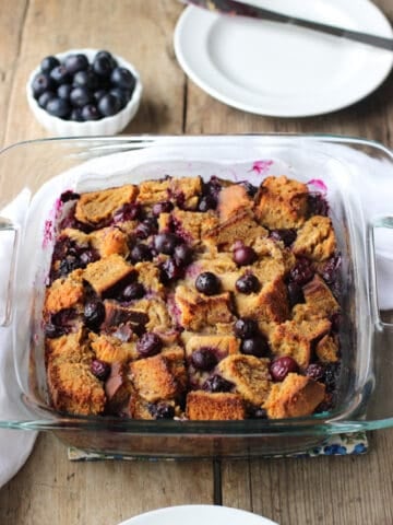The blueberry french toast bake in a square glass baking dish.