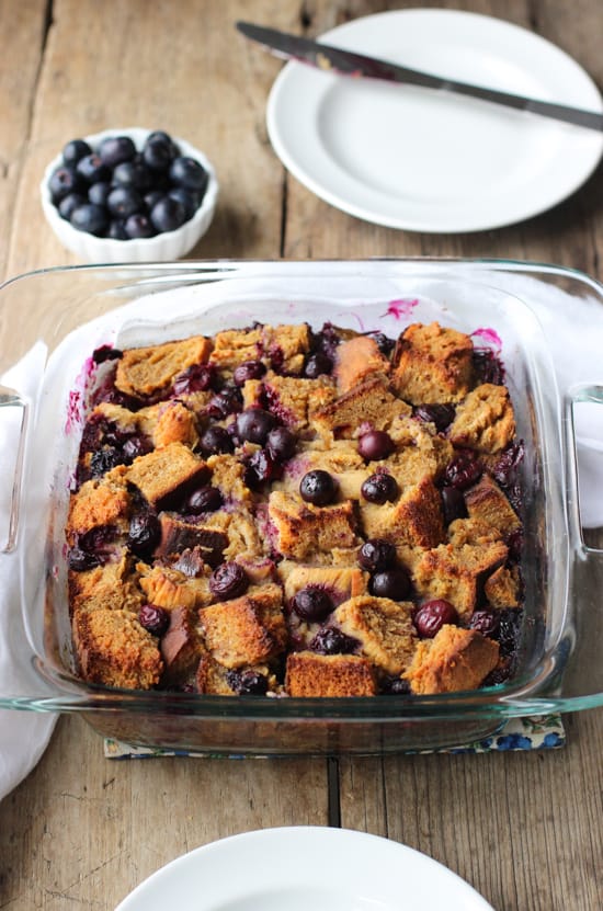 The blueberry french toast bake in a square glass baking dish.