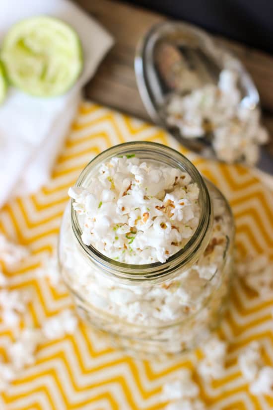 Popcorn filling a large glass jar and spilling out