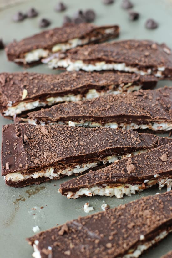 A side-view of wedges of chocolate coconut bark.