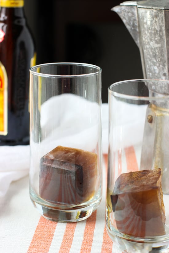 Coffee ice cubes in two tall glasses.