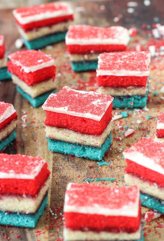 Rainbow cookies on a wooden cutting board 