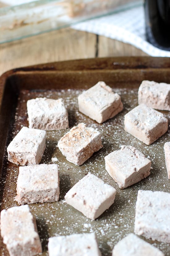 Sliced marshmallows on a metal baking sheet.