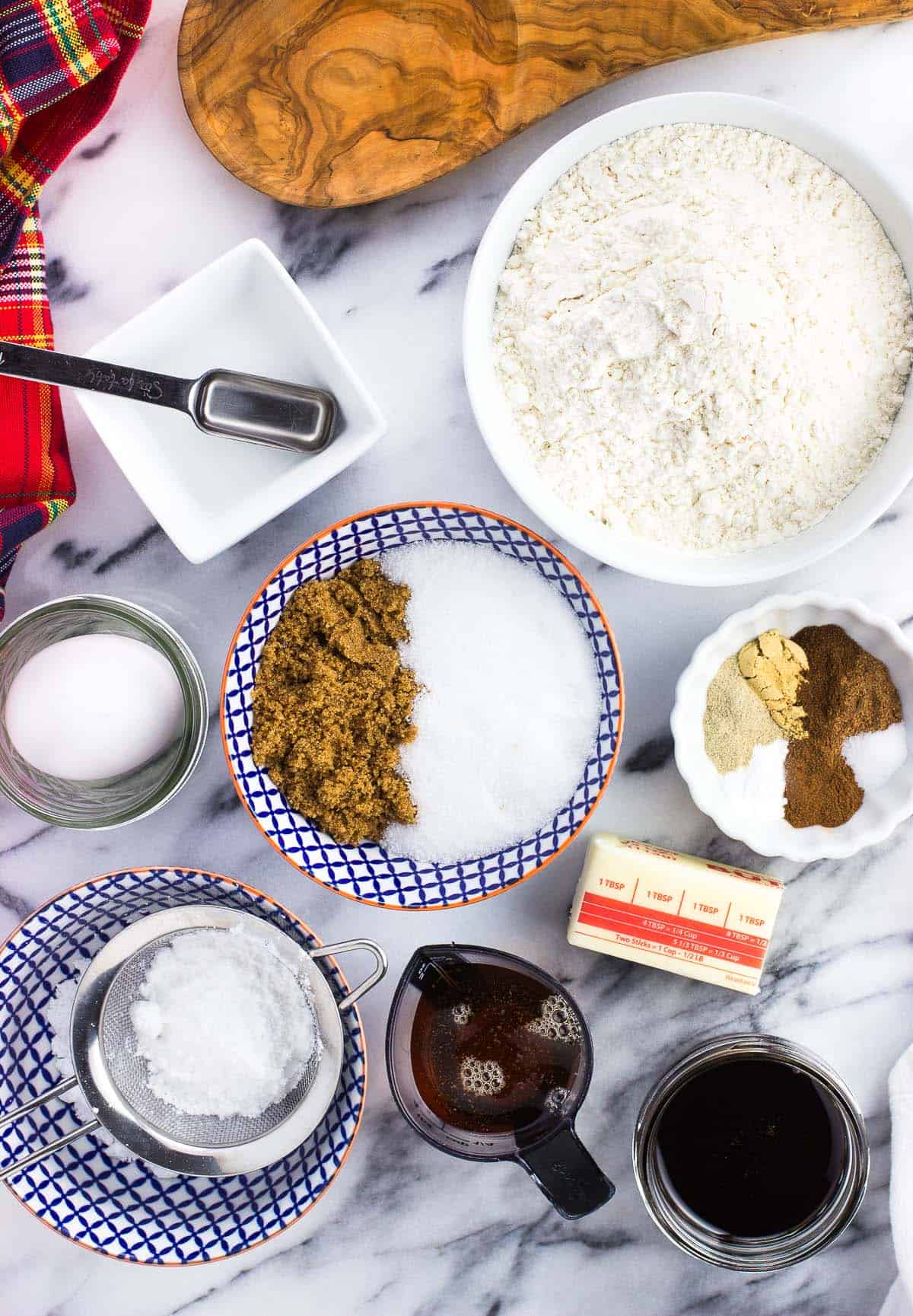 All of the recipe ingredients on a marble board in separate containers.