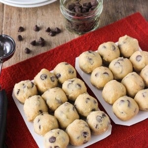 Two trays of rolled raw cookie dough balls.