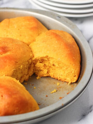 One roll removed from the pan after baking.