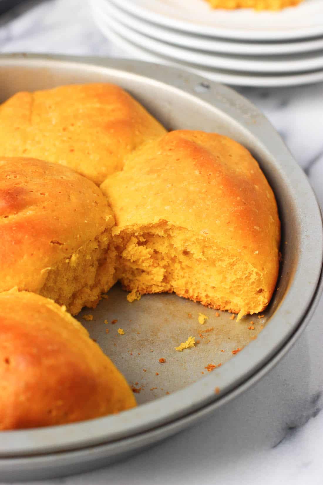 One roll removed from the pan after baking.