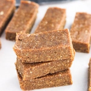 A stack of energy bars on a cutting board.