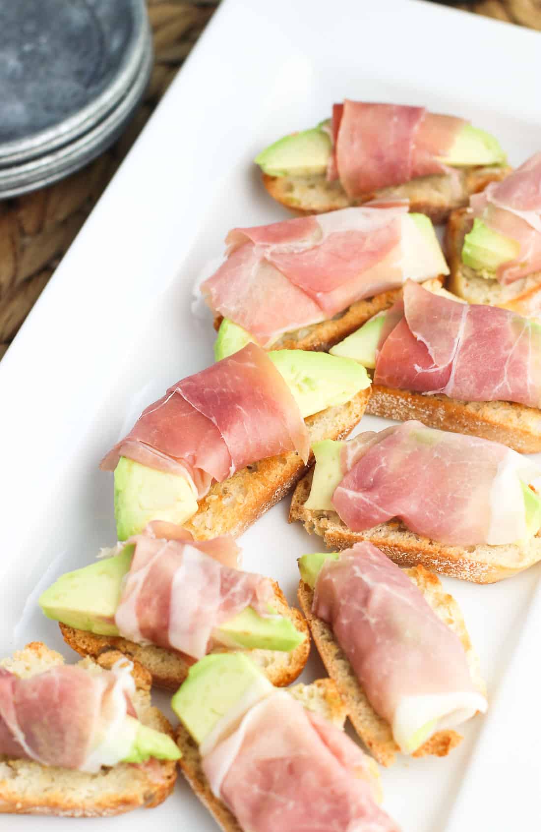 Prosciutto-Wrapped Avocado Crostini are a quick and delicious appetizer recipe, topped with a simple balsamic glaze.