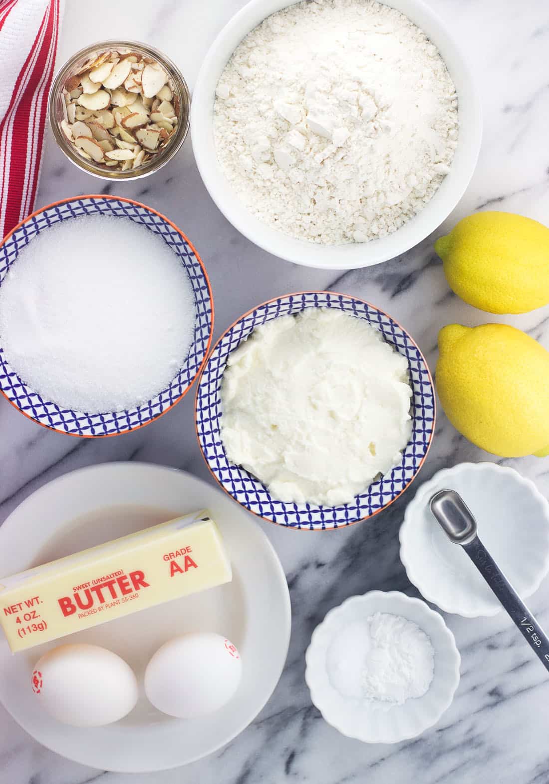 An overhead shot of the lemon ricotta muffin ingredients in separate bowls