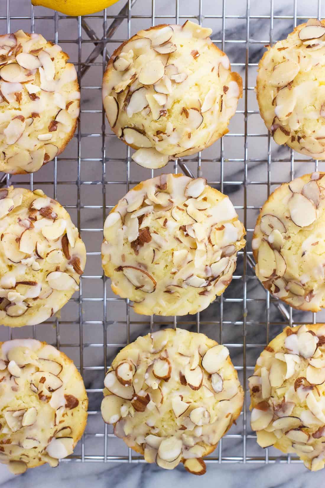 An overhead shot of cooked muffins on a wire rack