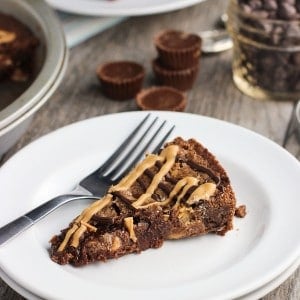 A slice of brownie pie on a plate with a fork.