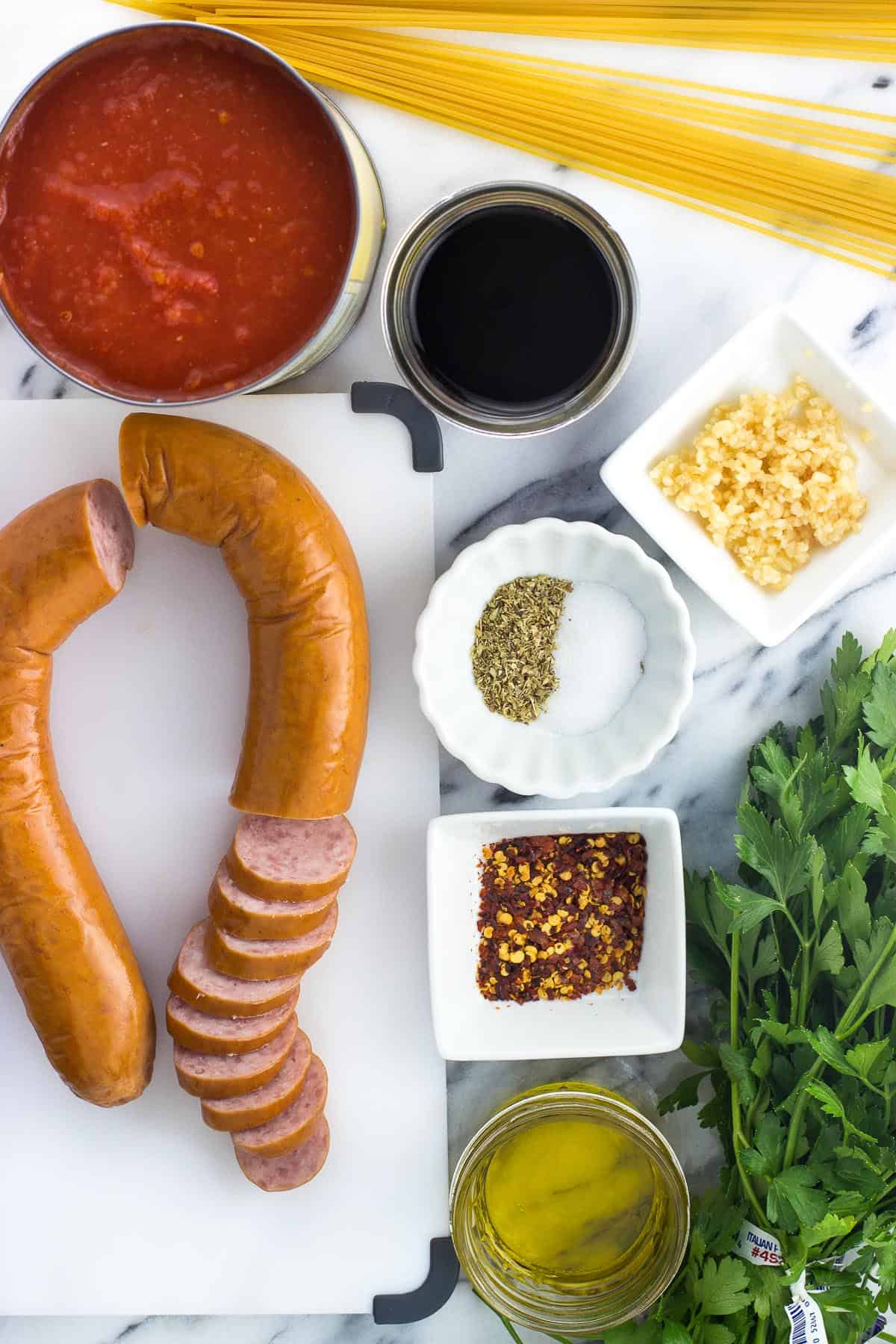 An overhead picture of all of the recipe ingredients in separate containers on a marble board