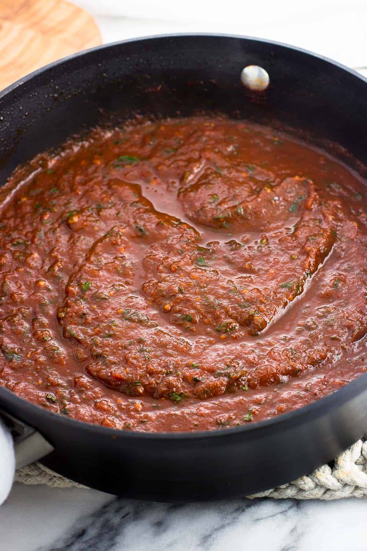 A pan of the thickened fra diavolo sauce before adding the spaghetti and smoked sausage.