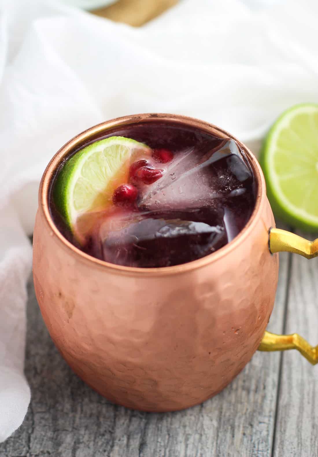 A close up of one of the drinks in a copper mug