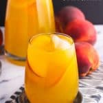 Mango peach white sangria is a fruity, refreshing, and just-sweet-enough spin on a classic cocktail. It’s a perfect peach sangria recipe using white wine for spring or summertime entertaining!