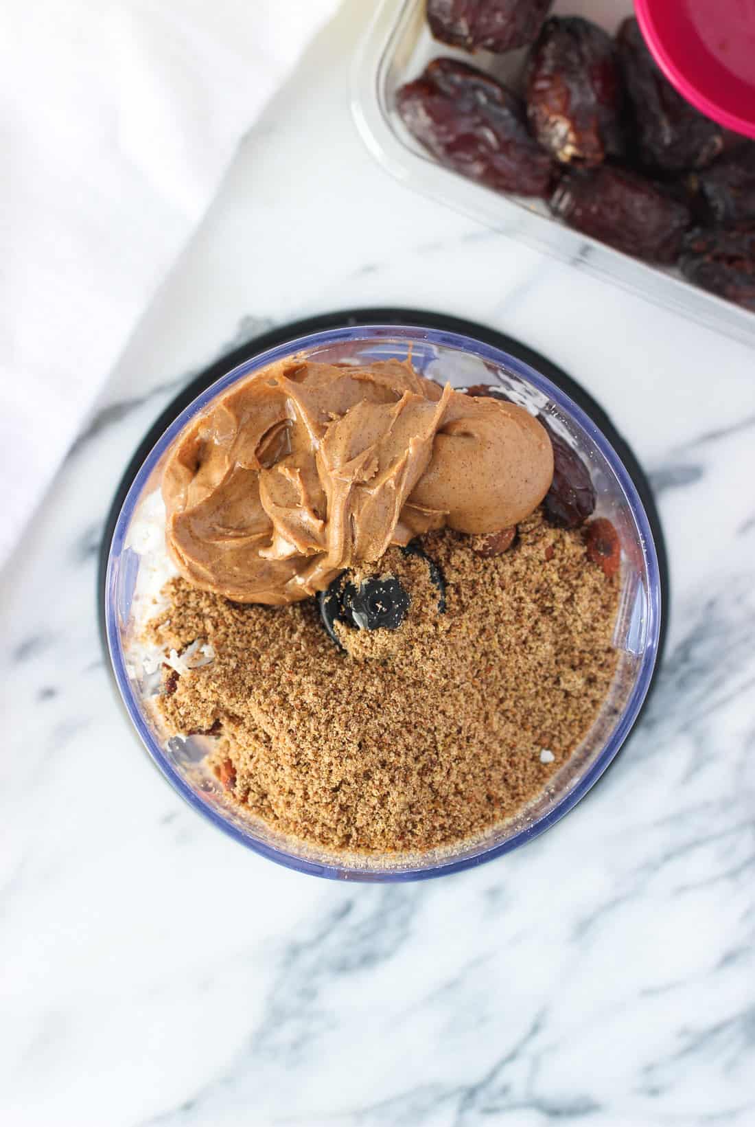 All of the ingredients in the bowl of a food processor before being processed