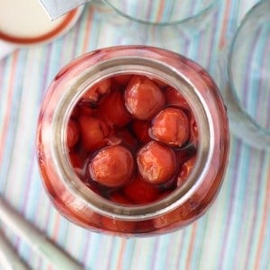 An overview view into the jar of maraschino cherries.