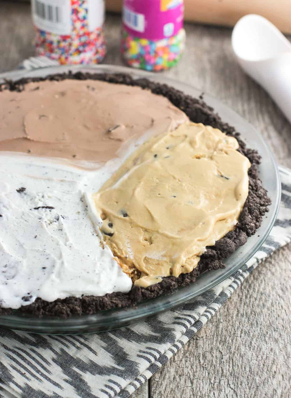 Three different types of ice cream pressed into the Oreo pie crust.